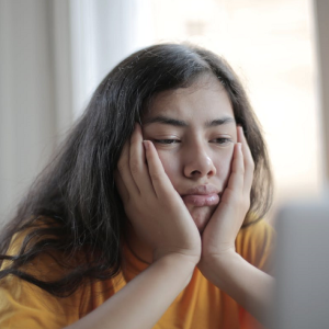 unhappy woman looking at her laptop