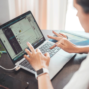 woman doing affiliate marketing on her laptop at home