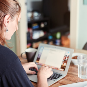 woman working online at home on her laptop