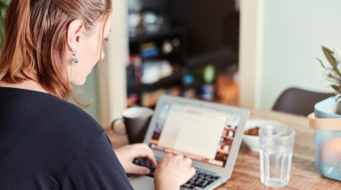 woman working online at home on her laptop