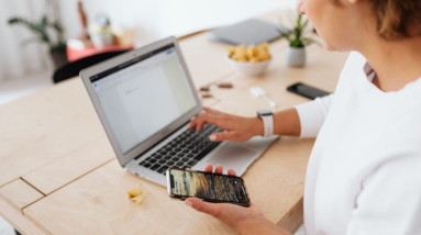 woman working online using laptop and smart phone